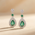 0.44ct Pear Cut Emerald and Diamond Halo Drop Earrings in 9K White Gold