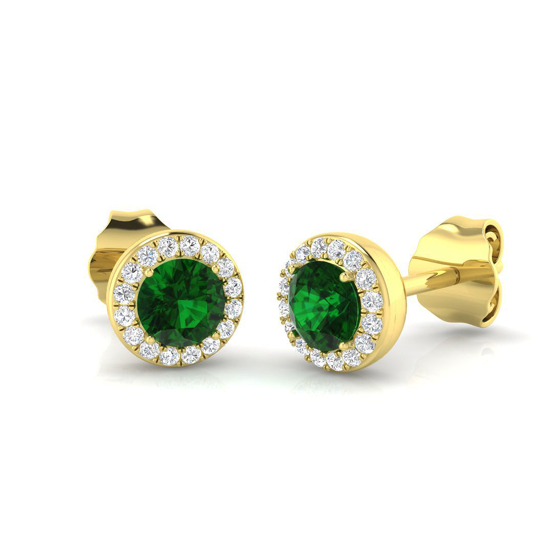 Green emerald halo earrings crafted in yellow gold