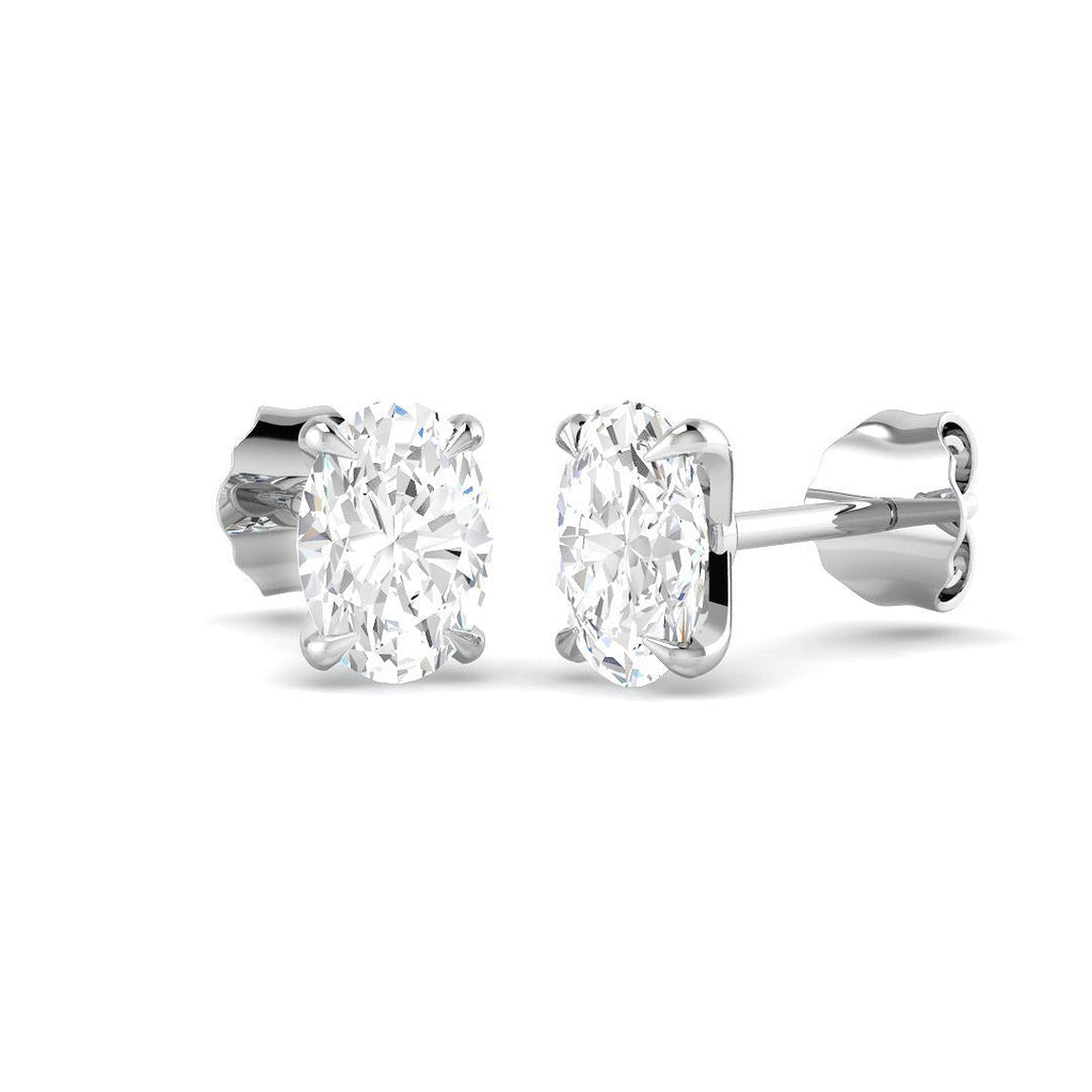 Pair of diamond stud earrings on a white background