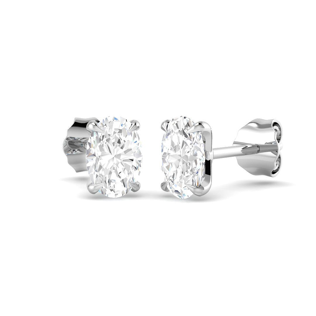 Pair of diamond stud earrings on a white background